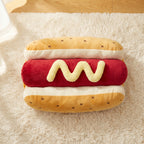 The hot dog costume laid flat: bun, red sausage and mustard squiggle
