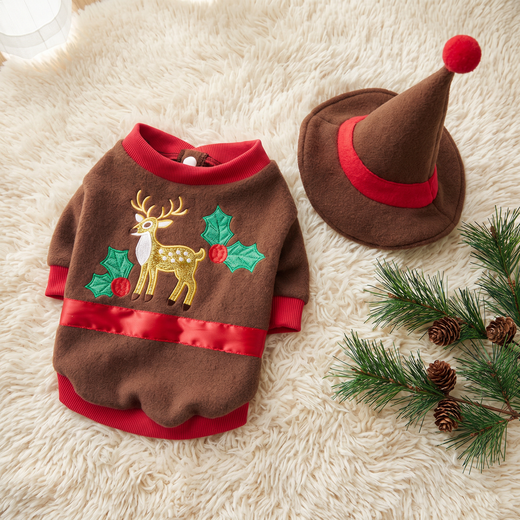 The Cocoa Reindeer Sweater laid flat with the pointed hat